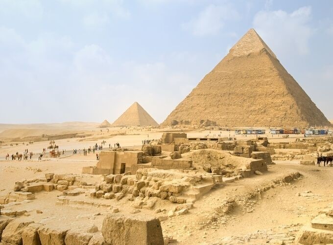 Aerial view of the Giza Plateau with pyramids and desert