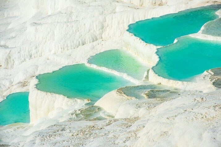 Pamukkale’s travertine terraces and pools offer a peaceful, healing retreat