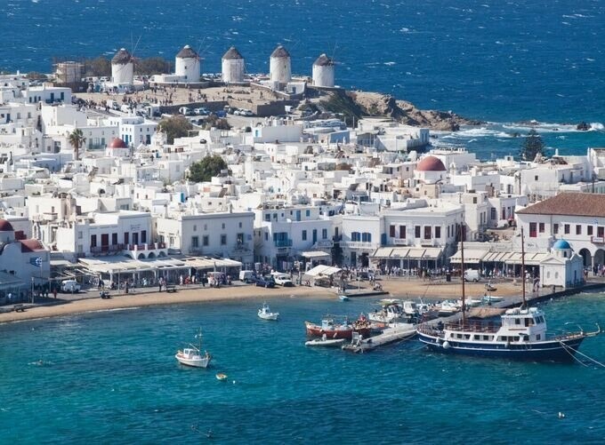 Whitewashed houses in Naxos town glowing under summer sunlight