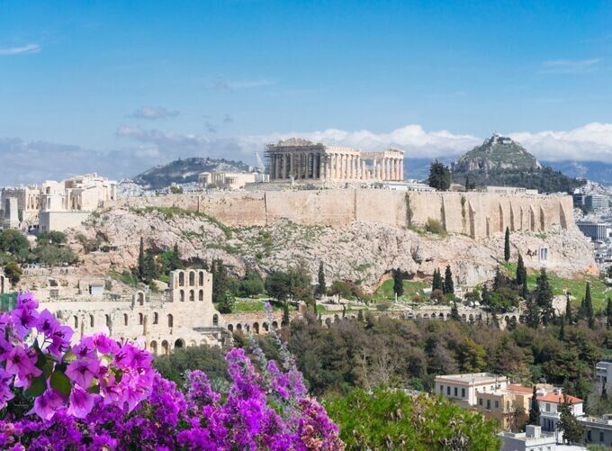 Parthenon ruins on Acropolis glowing under Mediterranean golden sunlight