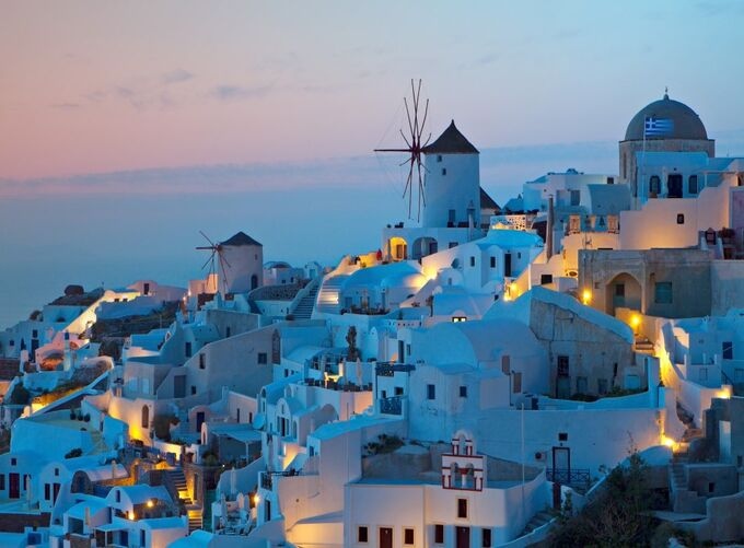 Cycladic charm of Santorini highlighted by golden hues at dusk