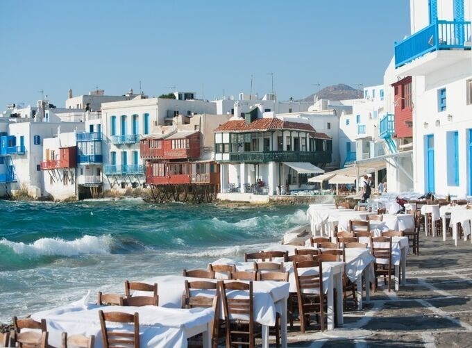 Narrow Mykonos streets bustling with visitors and vibrant Mediterranean charm