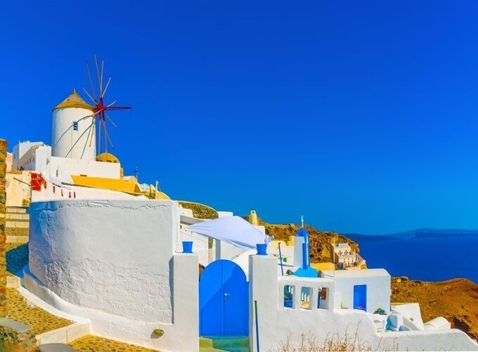 Mykonos harbor buzzing with colorful fishing boats and serene waters