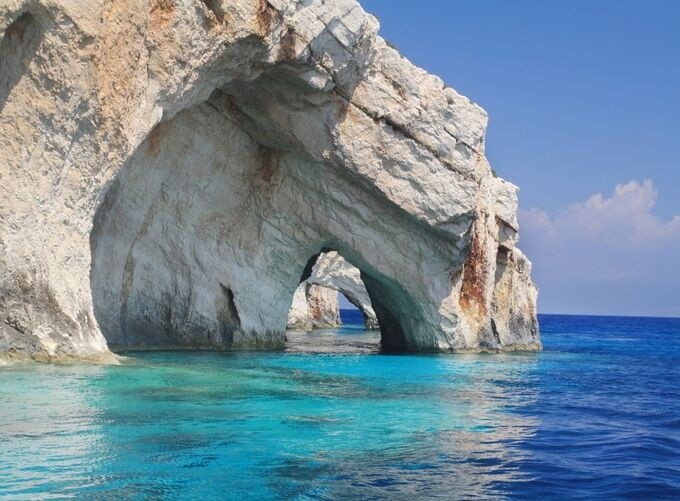 Golden sands of Zakynthos beaches meeting crystal-clear Aegean waters