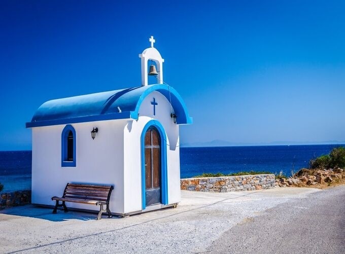 Golden sunset over Naxos Portara with shimmering sea views