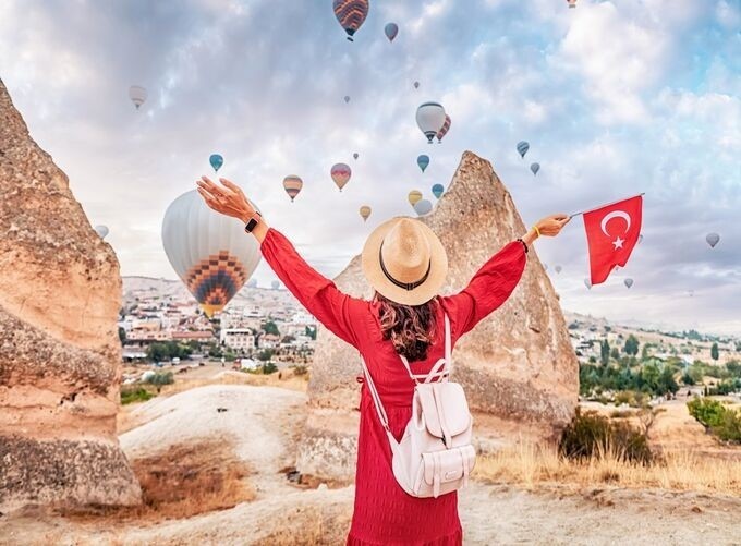 Cappadocia balloons float above fairy chimneys in a breathtaking sunrise