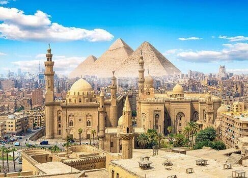 Mosque of Ibn Tulun in Cairo surrounded by vibrant urban life