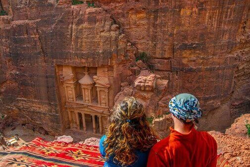 The Siq’s towering sandstone walls guiding visitors to Petra’s treasures